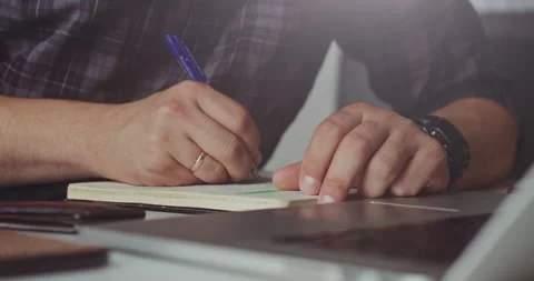 Writing notes and financial plans Stock Footage 320945347