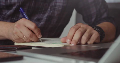 Writing notes and financial plans Stock Footage 320945354