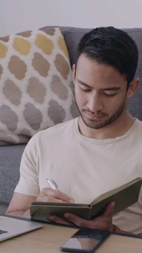 Writing, notes and man with laptop, living room and author with freelance Stock Footage 336223665