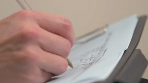 Writing Notes on Clipboard  Stock Footage 118968172