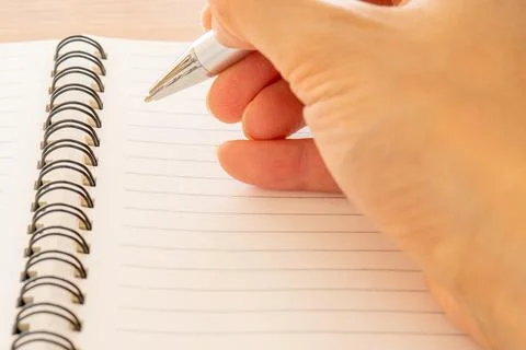 Writing notes with man's hand Stock Photos