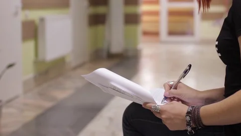Writing notes in a notebook Stock Footage 129464036