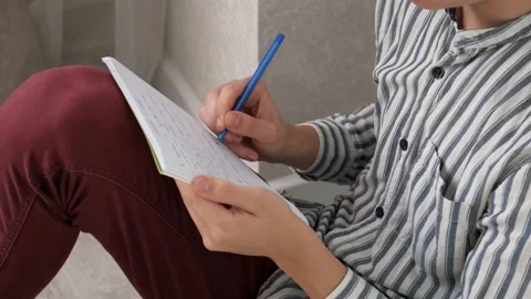 Writing notes in notebook. Hands close up. Creative. Ideas. Notes on the sheet Stock Footage 140920739