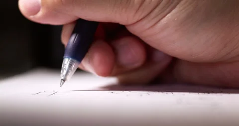 Writing numbers while solving a math problem using a blue pen and paper. Stock Footage 277251769