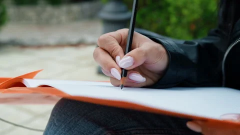 Writing on the paper with pencil Stock Footage 276558736