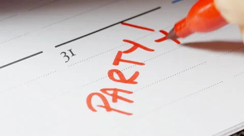 Writing party date on calendar Stock Footage 33822064