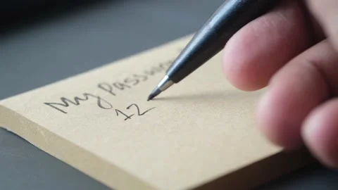 Writing password on a sticky note Stock Footage 166096967