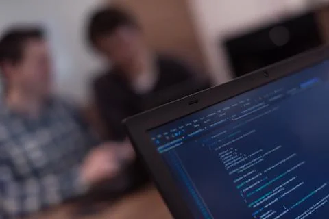 Writing programming code on laptop 写真素材