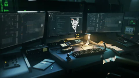 Writing the programming language code into the tech inside of the control room Stock Footage 312022330