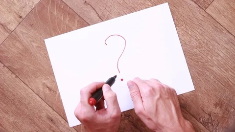 Writing question mark with red marker Stock Footage 94440339