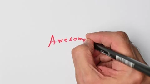 Writing with a red marker the sentence: Awesome Stock Footage 221781372