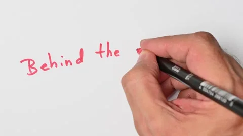 Writing with a red marker the sentence: Behind the eight ball Stock Footage 221783178