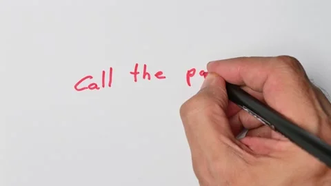 Writing with a red marker the sentence: Call the police Stock Footage 221781205