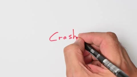 Writing with a red marker the sentence: Crash Stock Footage 221782284