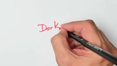 Writing with a red marker the sentence: Dork Stock Footage 221782691