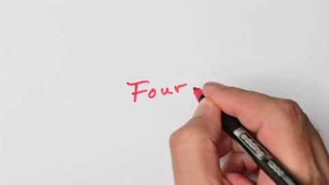 Writing with a red marker the sentence: Four Stock Footage 221783978
