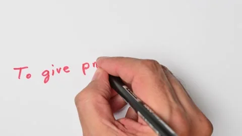 Writing with a red marker the sentence: To give props to someone Stock Footage 221782437