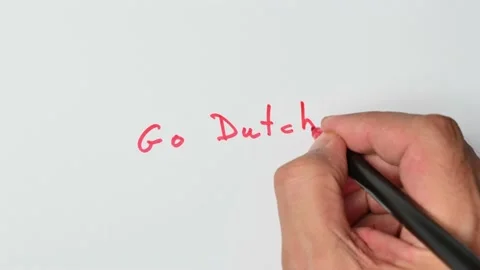 Writing with a red marker the sentence: Go Dutch Stock Footage 221783766