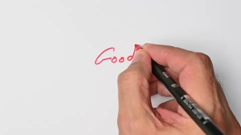 Writing with a red marker the sentence: Good Stock Footage 221780768