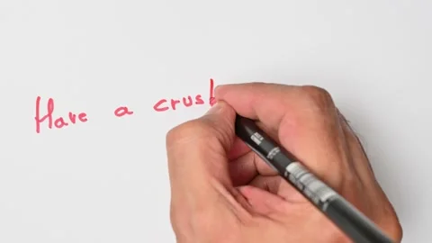 Writing with a red marker the sentence: Have a crush on someone Stock Footage 221782349