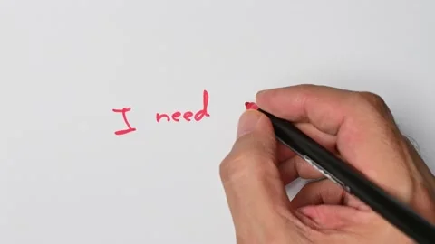 Writing with a red marker the sentence: I need help Stock Footage 221781174