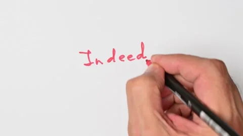 Writing with a red marker the sentence: Indeed Stock Footage 221782271