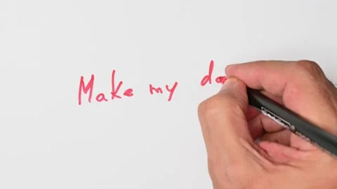 Writing with a red marker the sentence: Make my day Stock Footage 221782062