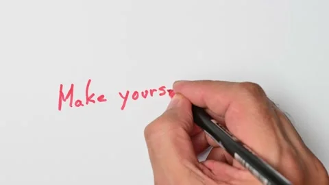 Writing with a red marker the sentence: Make yourself home Stock Footage 221782867