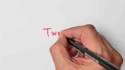 Writing with a red marker the sentence: Two Stock Footage 221783865