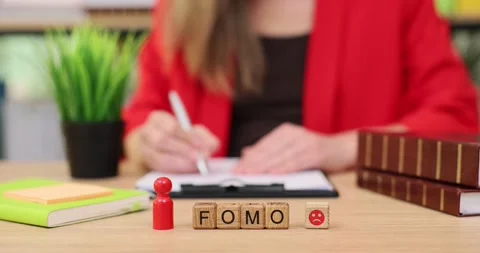 Writing reflections while embracing FOMO in a cozy study setting during a calm Stock Footage 320533834