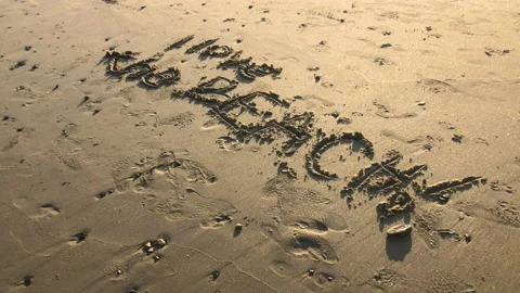 Writing in the sand Stock Footage 200562953