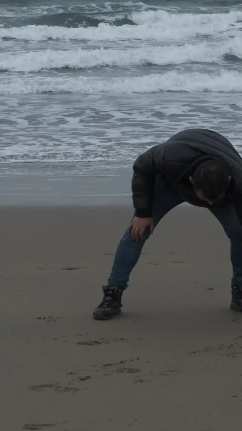 Writing in the sand Stock Footage 296602070