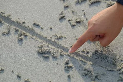 Writing on the sand Stock Photos