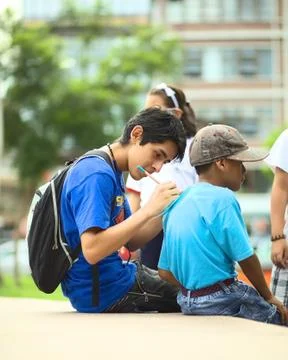 Writing on the shoulders of another Stock Photos
