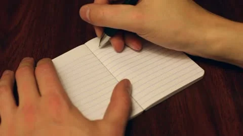 Writing in small notebook journal 動画素材 11020197