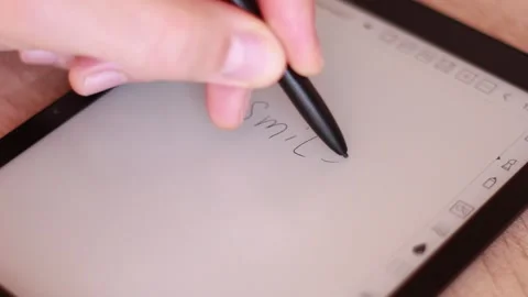 Writing SMILE in digital tablet Stock Footage 165325213