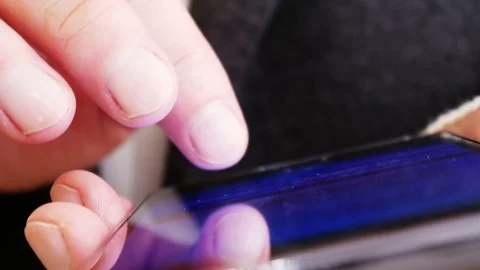 Writing sms on mobile phone 4K Video stock 71002550