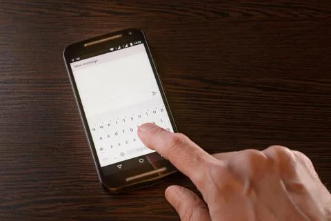 Writing Sms on Smartphone 写真素材