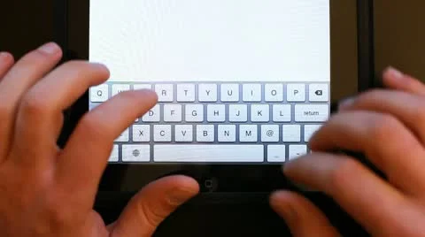 Writing sms on the tablet Stock Footage 10735490