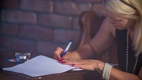 Writing something down on a piece of paper Stock Footage 112200228