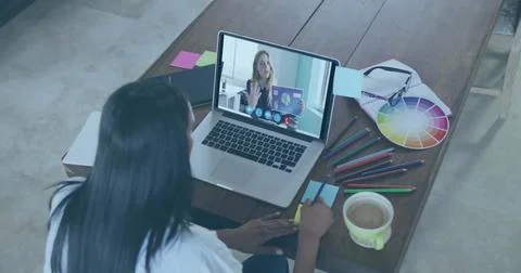 Writing student watching presentation board on laptop in home workspace, with Stock Photos