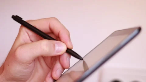 Writing with stylus in digital tablet Stock Footage 165325240