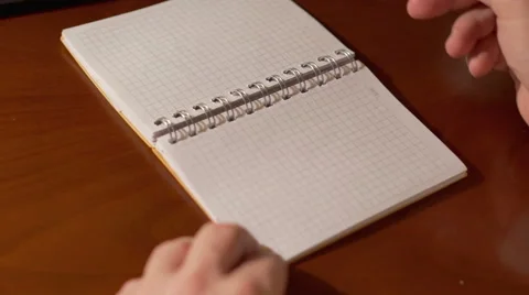 Writing SUPER on the notebook  Stock Footage 62087053