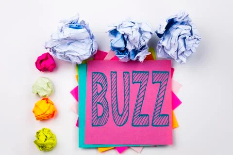 Writing text showing Buzz written on sticky note in office with screw paper b Stock Photos
