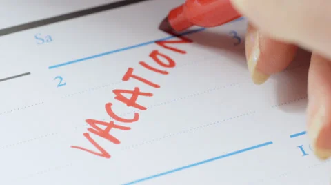Writing vacation date on calendar Stock Footage 33821893