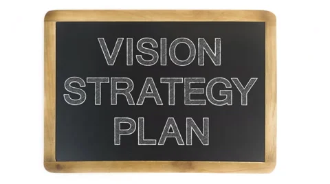 Writing vision, strategy and plan on a chalkboard Stock Footage 60432350