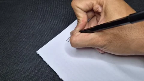Writing on a white paper Stock Footage 297547047