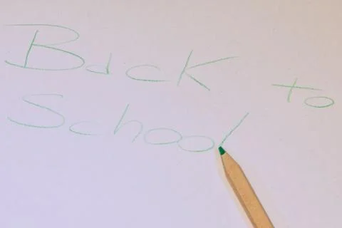 Written "back to school" made with a colored pencil on white paper Stock Photos