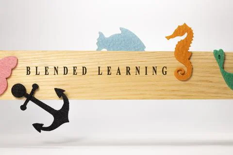 Written on a blended learning wood patterned surface. Education and child psy Stock Photos