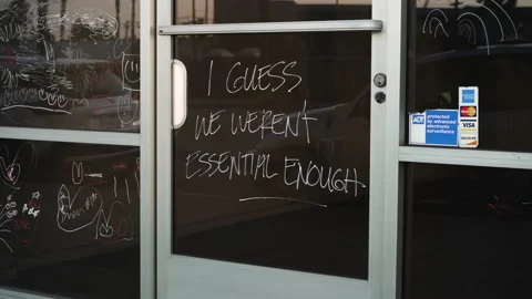 Written on the Door of a Closed Down Shop: I Guess We Weren’t Essential Enough Stock Footage 138544397
